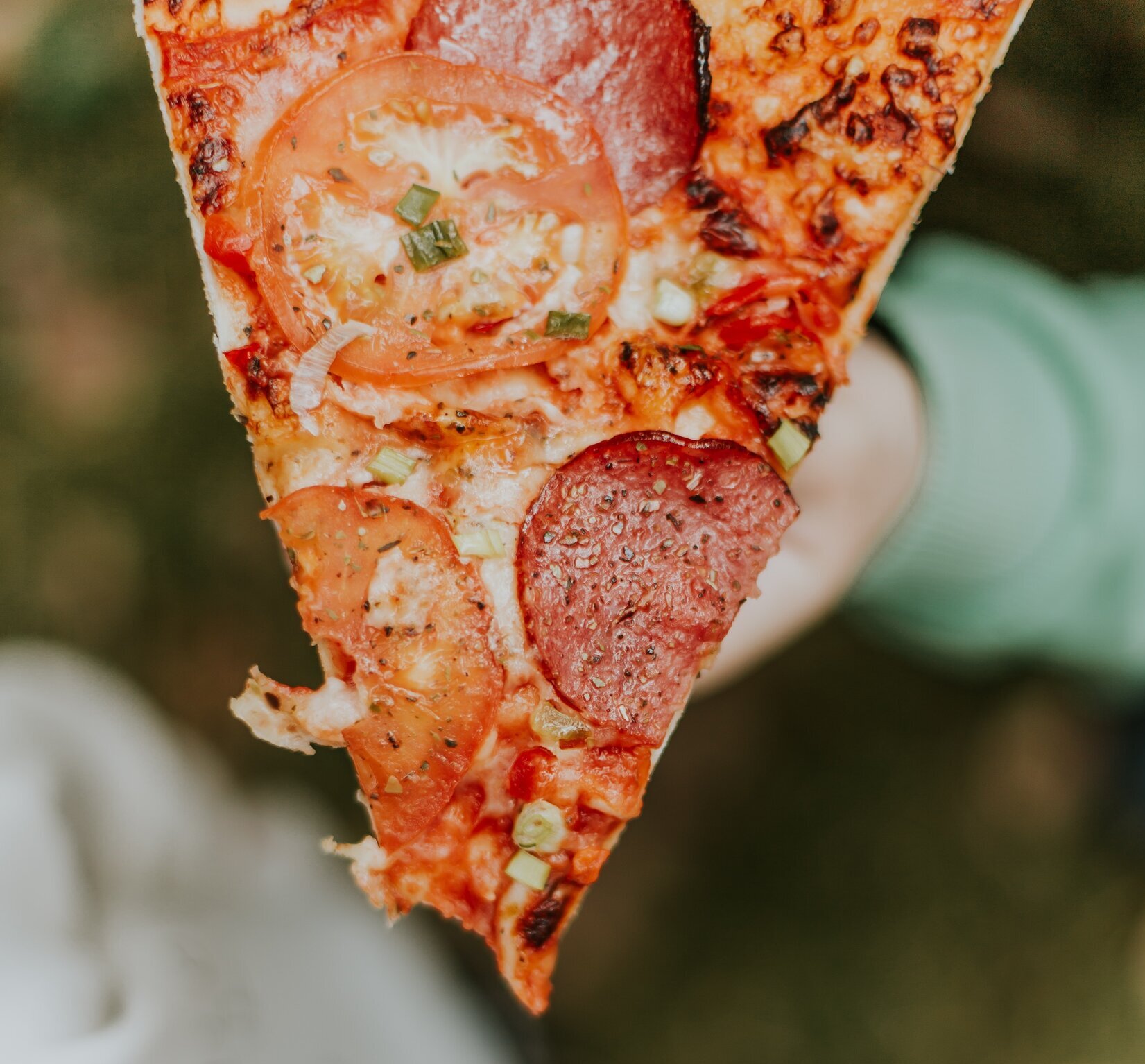 person eating pizza